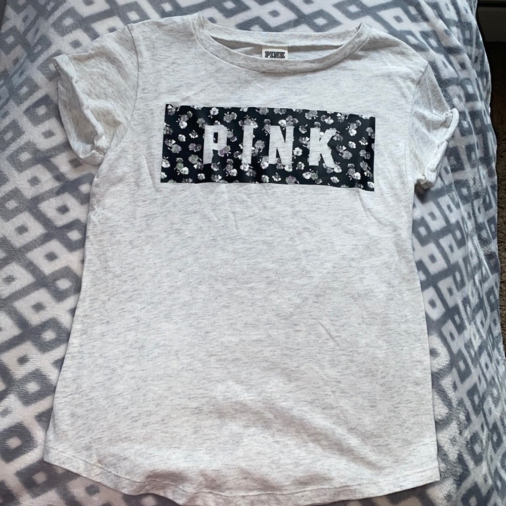 A grey shirt with flowers